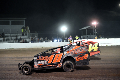 Blayden Arquiette (18) battles Ty Davis (14) in the Novice Sportsman Modified A Main