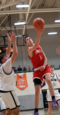 swoops under the defender