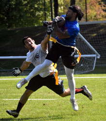 leaping ahead of defender