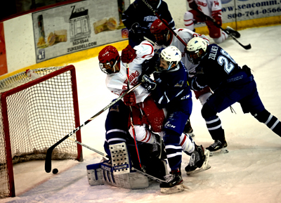 knocked to the ice and score